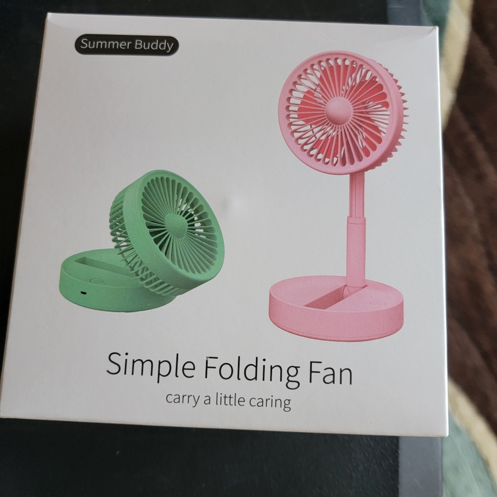 New In Box Mini 3 speed fold down fan colors are white,green,and pink 1 AA batte